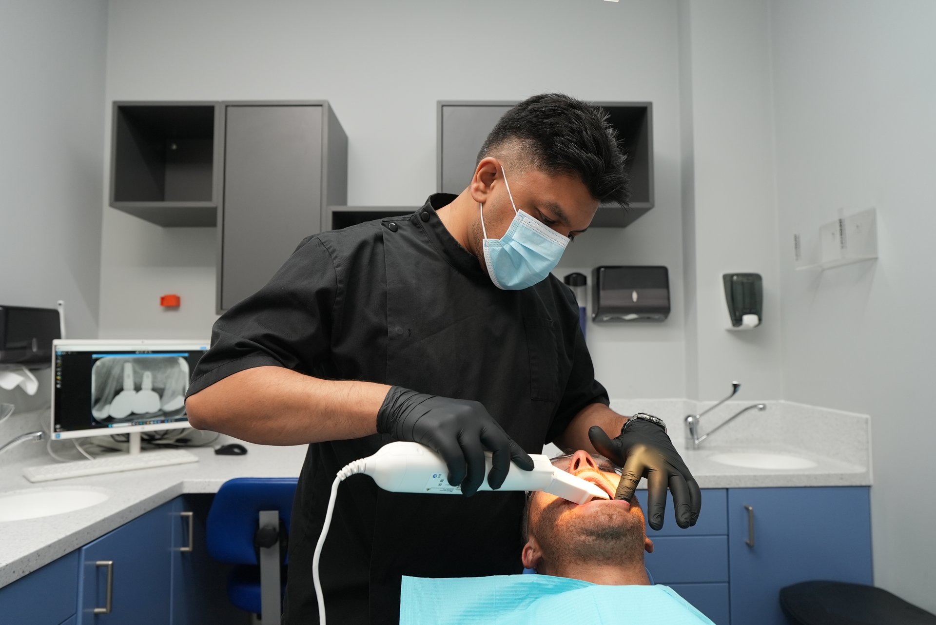 Dentist examining a patient at Welling Dental Studio