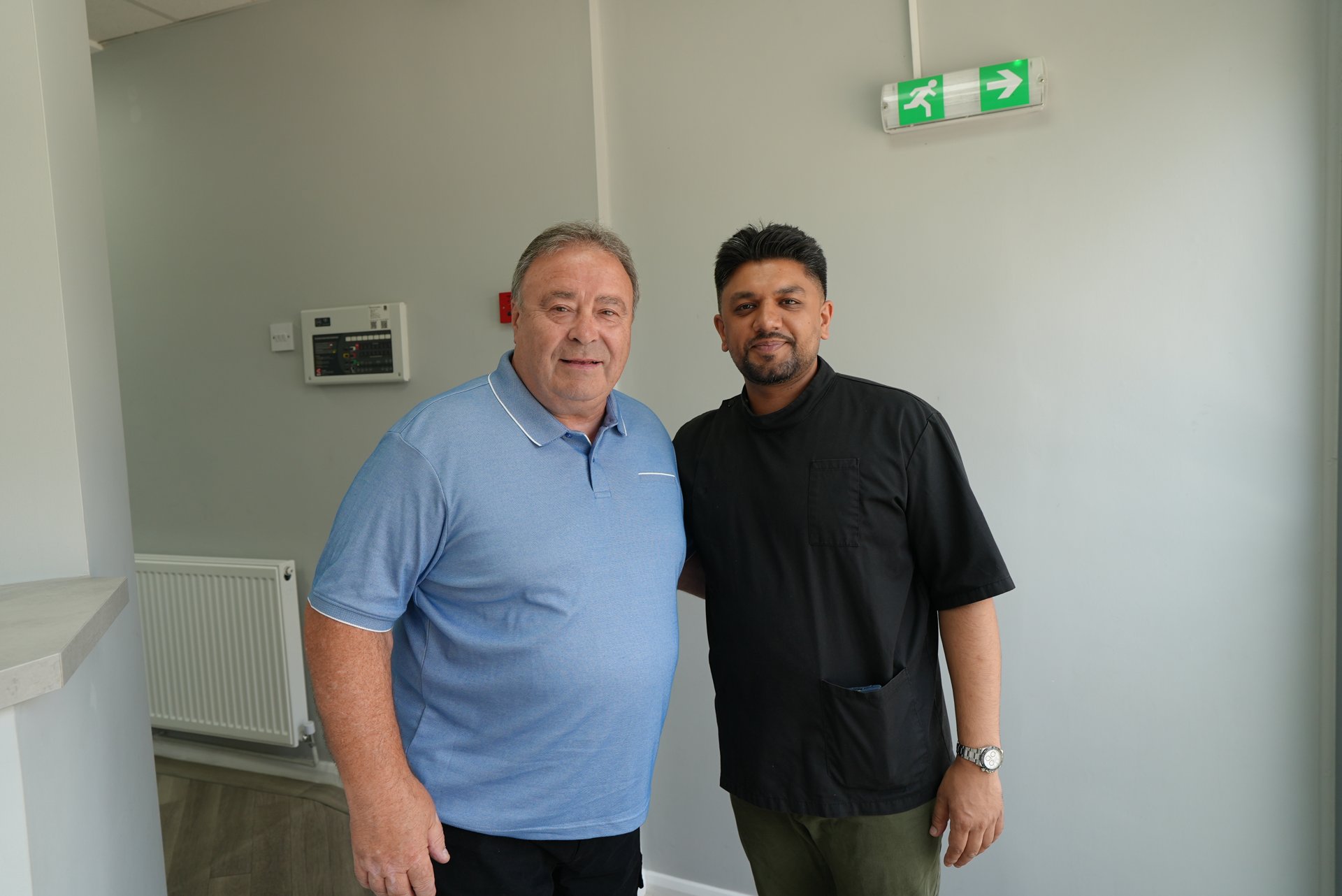 Dr Manraj Sandher with a patient at Welling Dental Studio