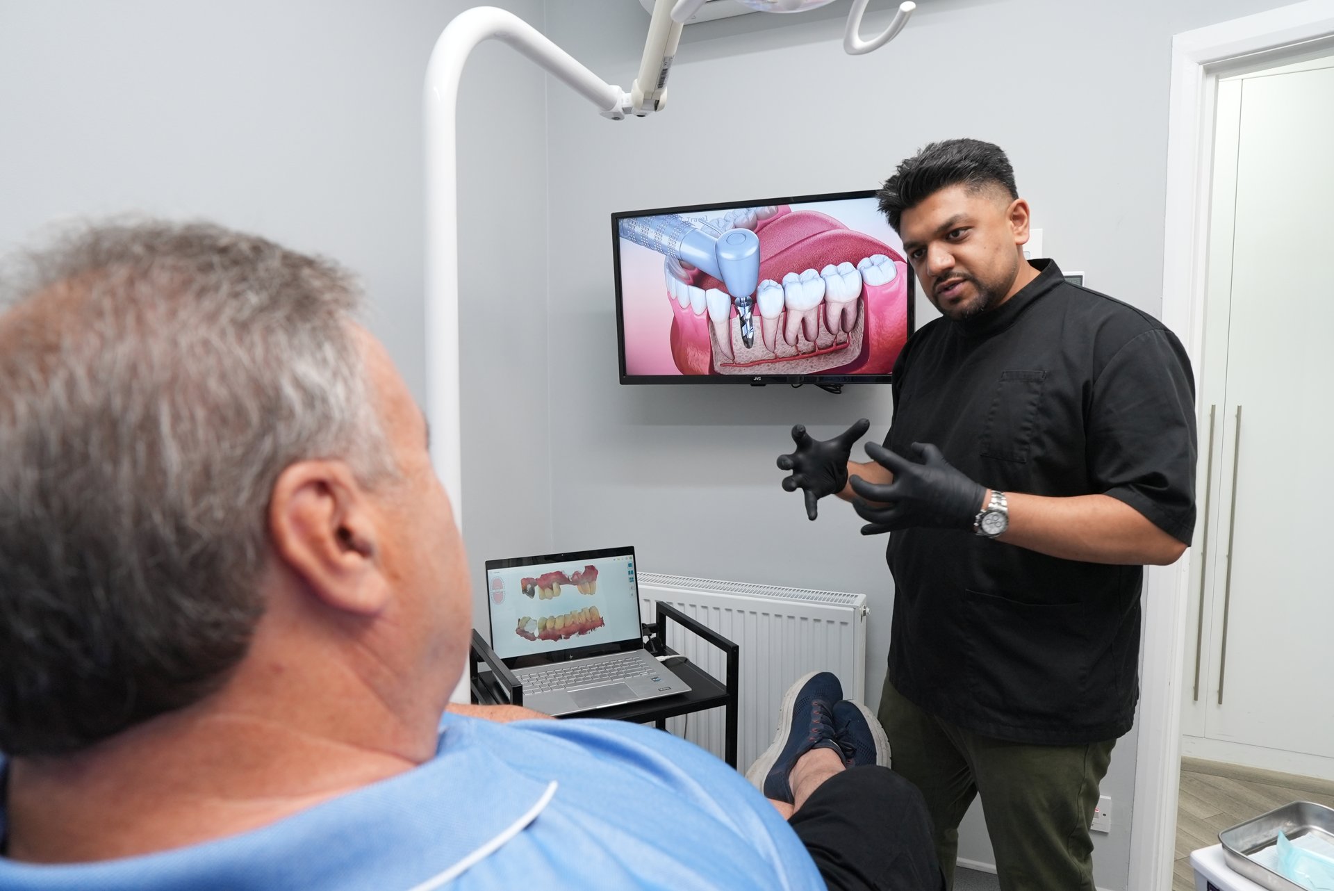Dentist explaining treatment options to a patient